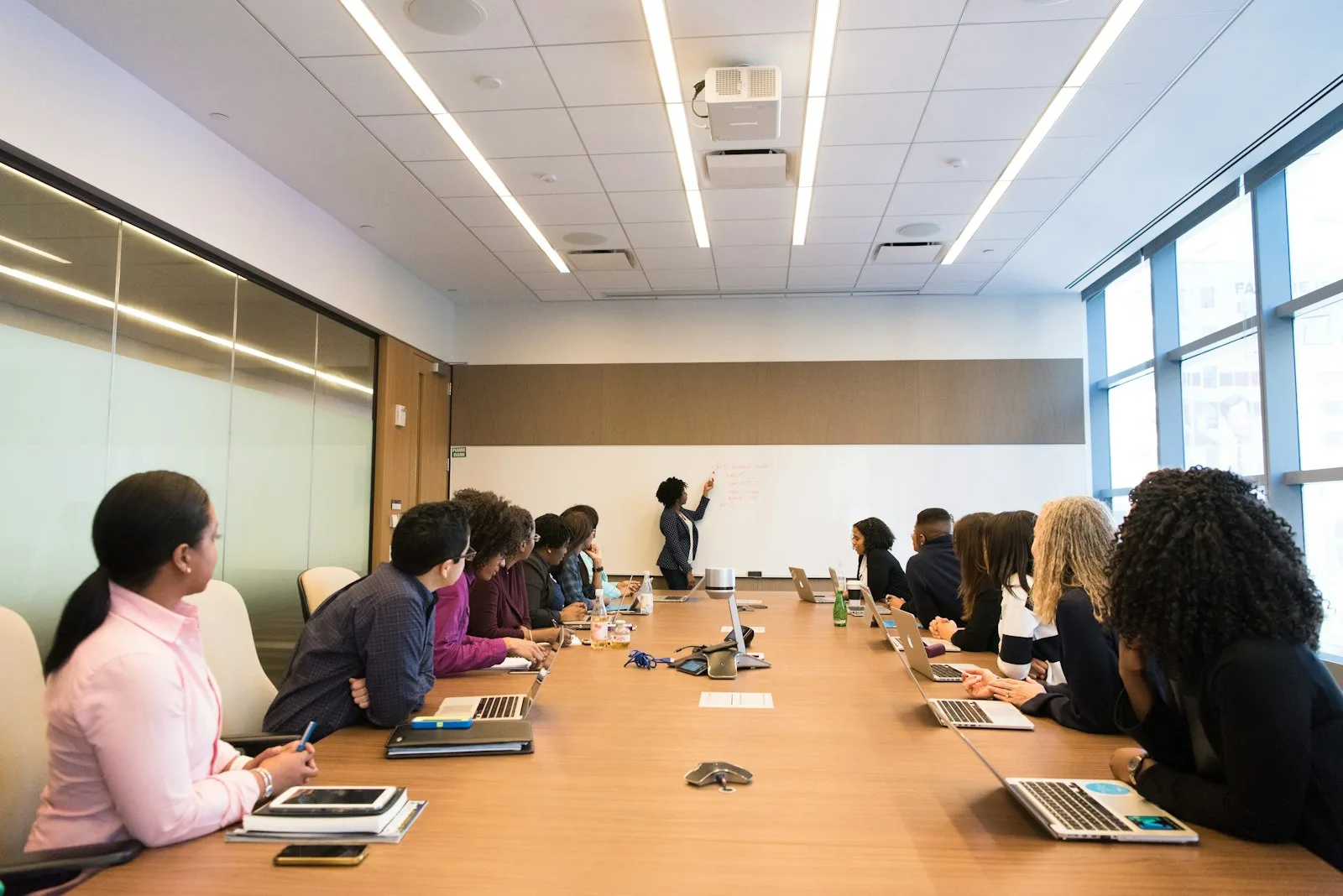 Capital raising consultant advising founders in a boardroom pitch meeting