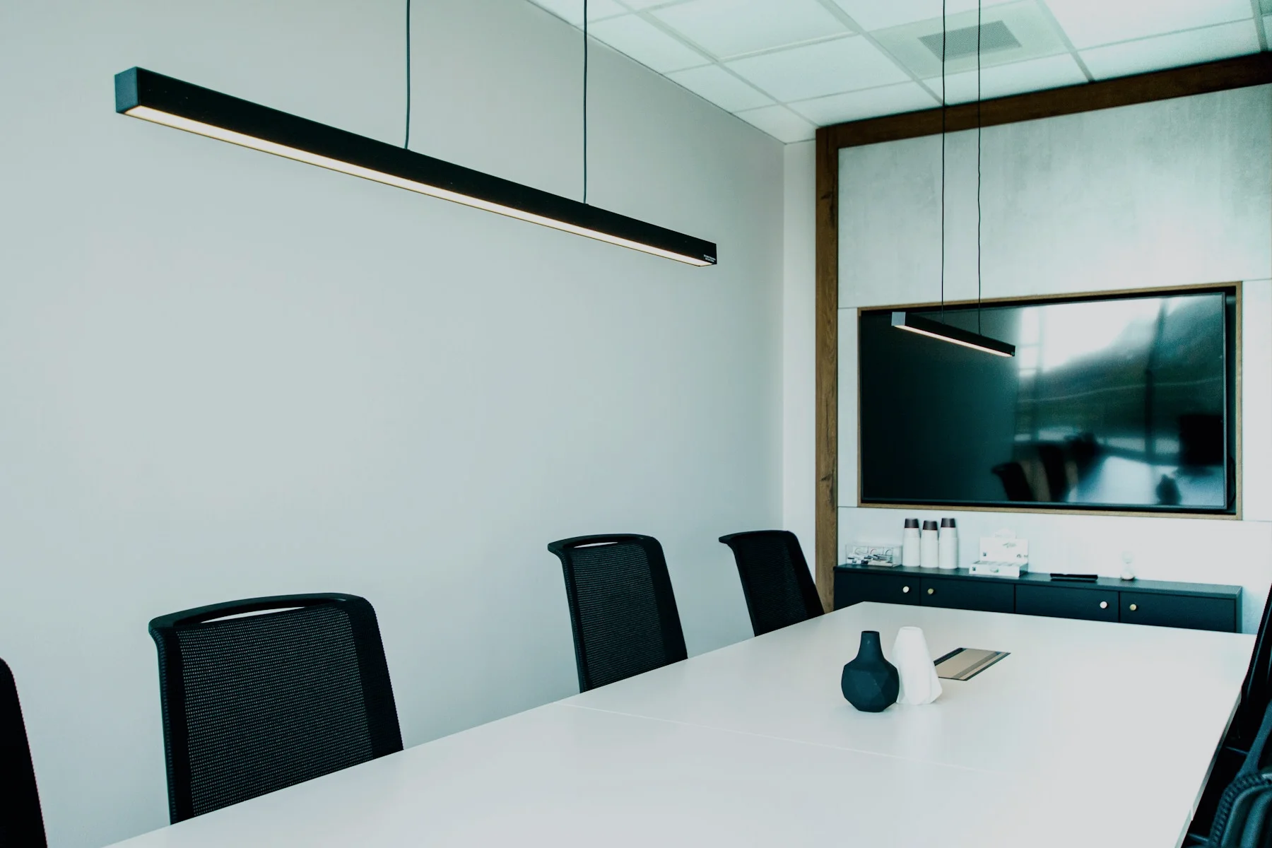Empty private advisory boardroom with conference table